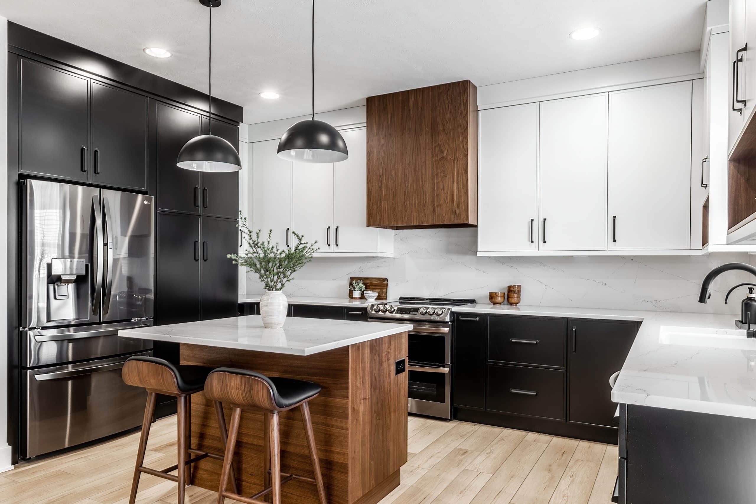 A close-up of refinished black kitchen cabinets in Wichita, KS, with sleek matte black finish and a polished granite countertop. The modern design features minimalist black hardware and premium materials, emphasizing expert cabinet refinishing.