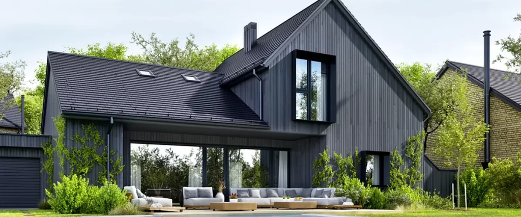 modern dark gray house exterior with pool lush landscaping and patio furniture