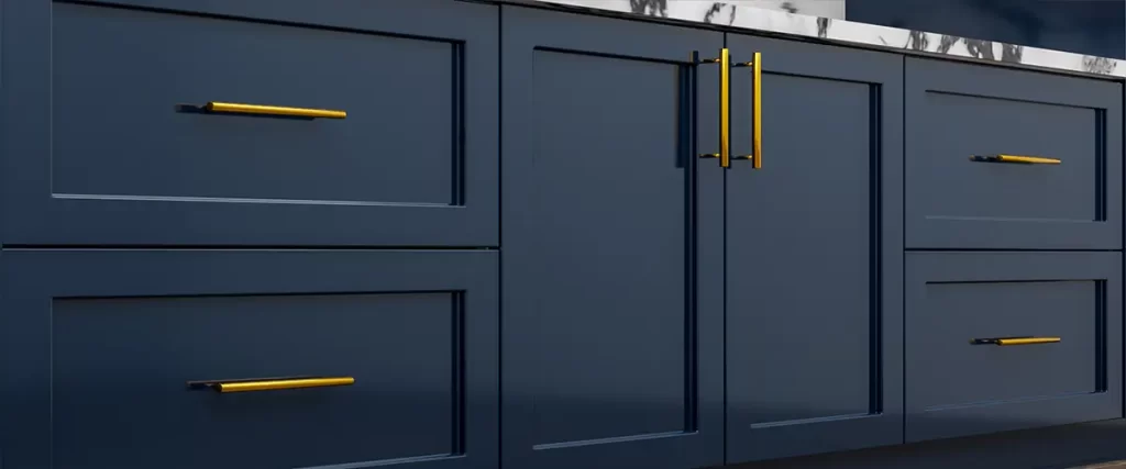 Dark blue painted cabinets with gold handles and marble countertop