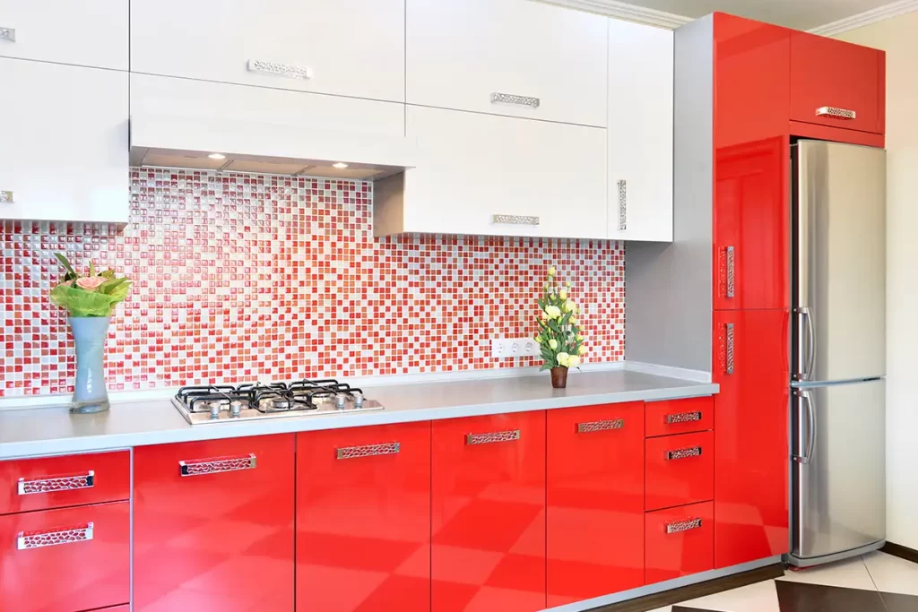 Modern bold kitchen with red base cabinets and white uppers